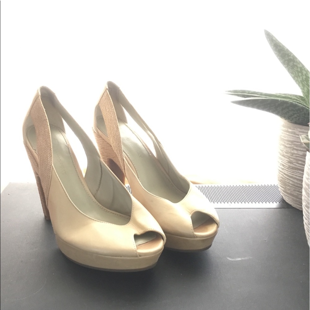 Cream-colored Anthropologie Peep Toe Pumps